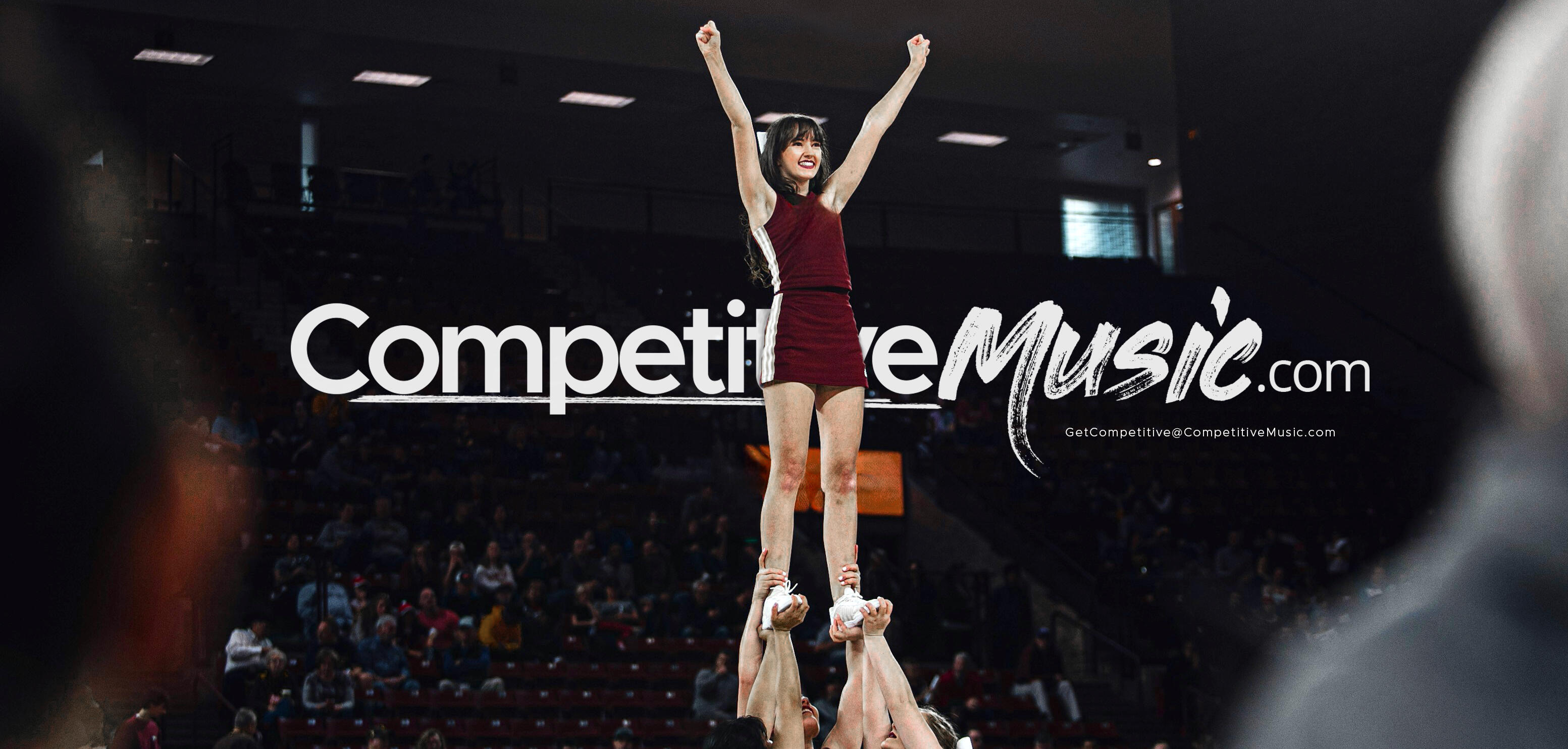 Competitive cheerleader in front of music editing logo Competitive cheerleader in the air in front of the music editing logo