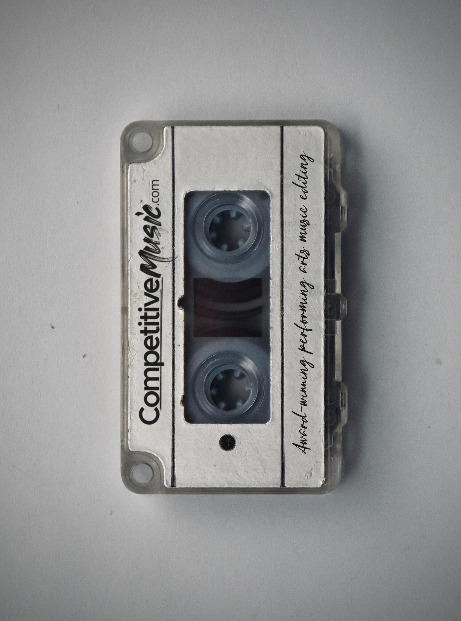 An old cassette tape with the logo for CompetitiveMusic.com on top.